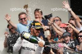 Race winner Lewis Hamilton (GBR) Mercedes AMG F1 celebrates with the champagne on the podium. 23.10.2016. Formula 1 World Championship, Rd 18, United States Grand Prix, Austin, Texas, USA, Race Day.