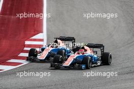 Esteban Ocon (FRA) Manor Racing MRT05 and team mate Pascal Wehrlein (GER) Manor Racing MRT05 battle for position. 23.10.2016. Formula 1 World Championship, Rd 18, United States Grand Prix, Austin, Texas, USA, Race Day.