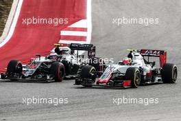 Esteban Gutierrez (MEX) Haas F1 Team VF-16 and Jenson Button (GBR) McLaren MP4-31 battle for position. 23.10.2016. Formula 1 World Championship, Rd 18, United States Grand Prix, Austin, Texas, USA, Race Day.