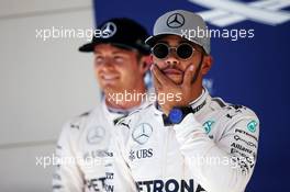 Pole sitter Lewis Hamilton (GBR) Mercedes AMG F1 in parc ferme with team mate Nico Rosberg (GER) Mercedes AMG F1. 22.10.2016. Formula 1 World Championship, Rd 18, United States Grand Prix, Austin, Texas, USA, Qualifying Day.