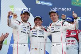 (L to R): Race winners Mark Webber (AUS), Timo Bernhard (GER) and Brendon Hartley (NZL) #01 Porsche Team Porsche 919 Hybrid, celebrate on the podium. 24.07.2016. FIA World Endurance Championship, Round 4, Nurburgring, Germany, Sunday.