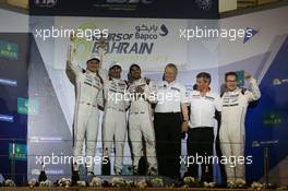 (L to R): Championship winners Marc Lieb (GER), Romain Dumas (FRA), Neel Jani (SUI) #02 Porsche Team Porsche 919 Hybrid, celebrate on the podium.  19.11.2016. FIA World Endurance Championship, Round 9, Six Hours of Bahrain, Sakhir, Bahrain, Saturday