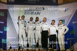 (L to R): Championship winners Marc Lieb (GER), Romain Dumas (FRA), Neel Jani (SUI) #02 Porsche Team Porsche 919 Hybrid, celebrate on the podium.  19.11.2016. FIA World Endurance Championship, Round 9, Six Hours of Bahrain, Sakhir, Bahrain, Saturday
