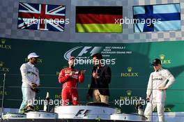 The podium (L to R): Lewis Hamilton (GBR) Mercedes AMG F1; Sebastian Vettel (GER) Ferrari; Mark Webber (AUS) Channel 4 Presenter; Valtteri Bottas (FIN) Mercedes AMG F1. 26.03.2017. Formula 1 World Championship, Rd 1, Australian Grand Prix, Albert Park, Melbourne, Australia, Race Day.