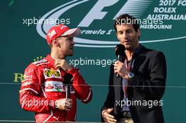 (L to R): Sebastian Vettel (GER) Ferrari with Mark Webber (AUS) Channel 4 Presenter on the podium. 26.03.2017. Formula 1 World Championship, Rd 1, Australian Grand Prix, Albert Park, Melbourne, Australia, Race Day.