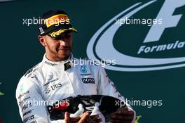Lewis Hamilton (GBR) Mercedes AMG F1 celebrates his second position on the podium. 26.03.2017. Formula 1 World Championship, Rd 1, Australian Grand Prix, Albert Park, Melbourne, Australia, Race Day.