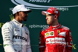 (L to R): Lewis Hamilton (GBR) Mercedes AMG F1 and Sebastian Vettel (GER) Ferrari on the podium. 26.03.2017. Formula 1 World Championship, Rd 1, Australian Grand Prix, Albert Park, Melbourne, Australia, Race Day.
