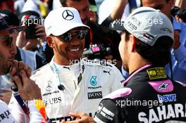 Lewis Hamilton (GBR) Mercedes AMG F1 with Sergio Perez (MEX) Sahara Force India F1. 26.03.2017. Formula 1 World Championship, Rd 1, Australian Grand Prix, Albert Park, Melbourne, Australia, Race Day.