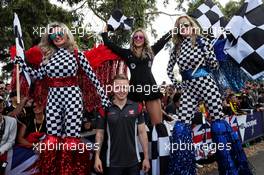 Kevin Magnussen (DEN) Haas F1 Team with girls on stilts. 23.03.2017. Formula 1 World Championship, Rd 1, Australian Grand Prix, Albert Park, Melbourne, Australia, Preparation Day.