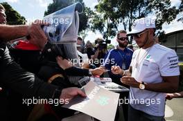 Lewis Hamilton (GBR) Mercedes AMG F1 signs autographs for the fans. 23.03.2017. Formula 1 World Championship, Rd 1, Australian Grand Prix, Albert Park, Melbourne, Australia, Preparation Day.