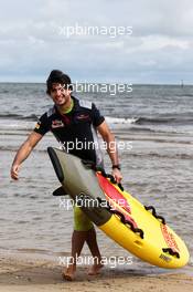 Carlos Sainz Jr (ESP) Scuderia Toro Rosso on St Kilda Beach with the St Kilda Lifesaving Club. 22.03.2017. Formula 1 World Championship, Rd 1, Australian Grand Prix, Albert Park, Melbourne, Australia, Preparation Day.