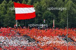 fans in the grandstand and a large Austrian flag. 09.07.2017. Formula 1 World Championship, Rd 9, Austrian Grand Prix, Spielberg, Austria, Race Day.