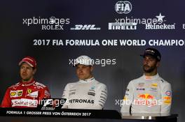The post race FIA Press Conference (L to R): Sebastian Vettel (GER) Ferrari, second; Valtteri Bottas (FIN) Mercedes AMG F1, race winner; Daniel Ricciardo (AUS) Red Bull Racing, third. 09.07.2017. Formula 1 World Championship, Rd 9, Austrian Grand Prix, Spielberg, Austria, Race Day.