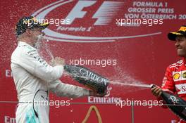 Valtteri Bottas (FIN) Mercedes AMG F1 W08 and Sebastian Vettel (GER) Ferrari SF70H. 09.07.2017. Formula 1 World Championship, Rd 9, Austrian Grand Prix, Spielberg, Austria, Race Day.
