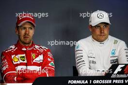 (L to R): Sebastian Vettel (GER) Ferrari with Valtteri Bottas (FIN) Mercedes AMG F1 in the FIA Press Conference. 09.07.2017. Formula 1 World Championship, Rd 9, Austrian Grand Prix, Spielberg, Austria, Race Day.