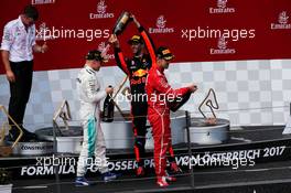 The podium (L to R): Race winner Valtteri Bottas (FIN) Mercedes AMG F1 celebrates with Sebastian Vettel (GER) Ferrari and Daniel Ricciardo (AUS) Red Bull Racing. 09.07.2017. Formula 1 World Championship, Rd 9, Austrian Grand Prix, Spielberg, Austria, Race Day.