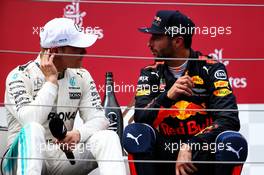 (L to R): Race winner Valtteri Bottas (FIN) Mercedes AMG F1 on the podium with third placed Daniel Ricciardo (AUS) Red Bull Racing. 09.07.2017. Formula 1 World Championship, Rd 9, Austrian Grand Prix, Spielberg, Austria, Race Day.