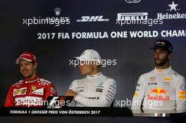 The post race FIA Press Conference (L to R): Sebastian Vettel (GER) Ferrari, second; Valtteri Bottas (FIN) Mercedes AMG F1, race winner; Daniel Ricciardo (AUS) Red Bull Racing, third. 09.07.2017. Formula 1 World Championship, Rd 9, Austrian Grand Prix, Spielberg, Austria, Race Day.