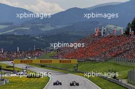 Daniil Kvyat (RUS) Scuderia Toro Rosso STR12 and Romain Grosjean (FRA) Haas F1 Team VF-17. 09.07.2017. Formula 1 World Championship, Rd 9, Austrian Grand Prix, Spielberg, Austria, Race Day.