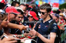 Daniil Kvyat (RUS) Scuderia Toro Rosso signs autographs for the fans. 08.07.2017. Formula 1 World Championship, Rd 9, Austrian Grand Prix, Spielberg, Austria, Qualifying Day.