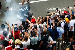 Lewis Hamilton (GBR) Mercedes AMG F1 with fans on his motorbike. 08.07.2017. Formula 1 World Championship, Rd 9, Austrian Grand Prix, Spielberg, Austria, Qualifying Day.