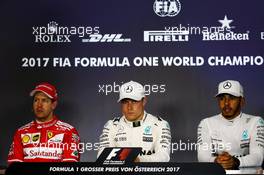The post qualifying FIA Press Conference (L to R): Sebastian Vettel (GER) Ferrari, second; Valtteri Bottas (FIN) Mercedes AMG F1, pole position; Lewis Hamilton (GBR) Mercedes AMG F1, third. 08.07.2017. Formula 1 World Championship, Rd 9, Austrian Grand Prix, Spielberg, Austria, Qualifying Day.