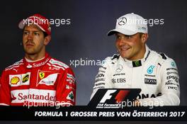 (L to R): Sebastian Vettel (GER) Ferrari and Valtteri Bottas (FIN) Mercedes AMG F1 in the post qualifying FIA Press Conference. 08.07.2017. Formula 1 World Championship, Rd 9, Austrian Grand Prix, Spielberg, Austria, Qualifying Day.
