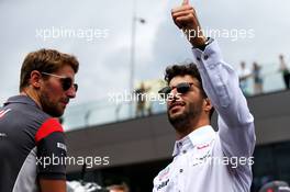 (L to R): Romain Grosjean (FRA) Haas F1 Team with Daniel Ricciardo (AUS) Red Bull Racing on the drivers parade. 09.07.2017. Formula 1 World Championship, Rd 9, Austrian Grand Prix, Spielberg, Austria, Race Day.