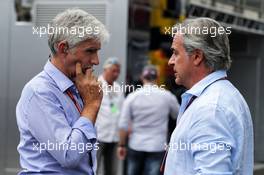 (L to R): Damon Hill (GBR) Sky Sports Presenter with Carlos Sainz (ESP). 09.07.2017. Formula 1 World Championship, Rd 9, Austrian Grand Prix, Spielberg, Austria, Race Day.