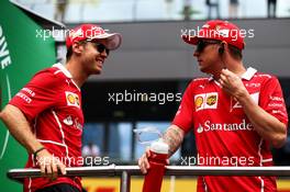 (L to R): Sebastian Vettel (GER) Ferrari with Kimi Raikkonen (FIN) Ferrari on the drivers parade. 09.07.2017. Formula 1 World Championship, Rd 9, Austrian Grand Prix, Spielberg, Austria, Race Day.