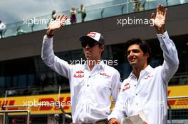 (L to R): Daniil Kvyat (RUS) Scuderia Toro Rosso with Carlos Sainz Jr (ESP) Scuderia Toro Rosso on the drivers parade. 09.07.2017. Formula 1 World Championship, Rd 9, Austrian Grand Prix, Spielberg, Austria, Race Day.