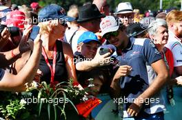 Carlos Sainz Jr (ESP) Scuderia Toro Rosso with fans. 09.07.2017. Formula 1 World Championship, Rd 9, Austrian Grand Prix, Spielberg, Austria, Race Day.
