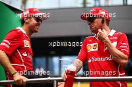(L to R): Sebastian Vettel (GER) Ferrari with Kimi Raikkonen (FIN) Ferrari on the drivers parade. 09.07.2017. Formula 1 World Championship, Rd 9, Austrian Grand Prix, Spielberg, Austria, Race Day.