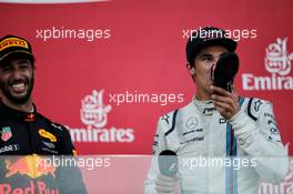 (L to R): Race winner Daniel Ricciardo (AUS) Red Bull Racing celebrates on the podium with third placed Lance Stroll (CDN) Williams. 25.06.2017. Formula 1 World Championship, Rd 8, Azerbaijan Grand Prix, Baku Street Circuit, Azerbaijan, Race Day.