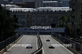 Daniil Kvyat (RUS) Scuderia Toro Rosso STR12 and Nico Hulkenberg (GER) Renault Sport F1 Team RS17. 24.06.2017. Formula 1 World Championship, Rd 8, Azerbaijan Grand Prix, Baku Street Circuit, Azerbaijan, Qualifying Day.