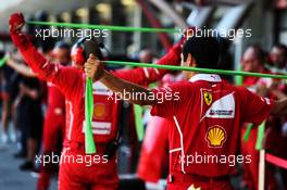 Ferrari mechanics practice warm up stretches. 25.06.2017. Formula 1 World Championship, Rd 8, Azerbaijan Grand Prix, Baku Street Circuit, Azerbaijan, Race Day.