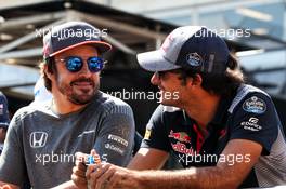 (L to R): Fernando Alonso (ESP) McLaren with Carlos Sainz Jr (ESP) Scuderia Toro Rosso on the drivers parade. 25.06.2017. Formula 1 World Championship, Rd 8, Azerbaijan Grand Prix, Baku Street Circuit, Azerbaijan, Race Day.