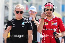 (L to R): Valtteri Bottas (FIN) Mercedes AMG F1 with Sebastian Vettel (GER) Ferrari. 25.06.2017. Formula 1 World Championship, Rd 8, Azerbaijan Grand Prix, Baku Street Circuit, Azerbaijan, Race Day.