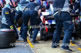 Carlos Sainz Jr (ESP) Scuderia Toro Rosso STR12 rear hub on the ground during a pit stop practice. 10.03.2017. Formula One Testing, Day Four, Barcelona, Spain. Friday.
