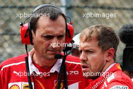 Sebastian Vettel (GER) Ferrari with Riccardo Adami (ITA) Ferrari Race Engineer on the grid. 27.08.2017. Formula 1 World Championship, Rd 12, Belgian Grand Prix, Spa Francorchamps, Belgium, Race Day.