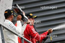 Race winner Lewis Hamilton (GBR) Mercedes AMG F1 celebrates with second placed Sebastian Vettel (GER) Ferrari on the podium. 27.08.2017. Formula 1 World Championship, Rd 12, Belgian Grand Prix, Spa Francorchamps, Belgium, Race Day.