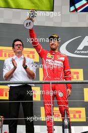 Sebastian Vettel (GER) Ferrari celebrates his second position on the podium. 27.08.2017. Formula 1 World Championship, Rd 12, Belgian Grand Prix, Spa Francorchamps, Belgium, Race Day.
