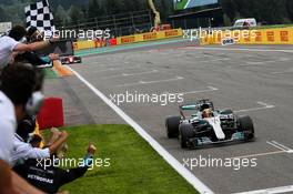 Race winner Lewis Hamilton (GBR) Mercedes AMG F1 W08 takes the chequered flag at the end of the race. 27.08.2017. Formula 1 World Championship, Rd 12, Belgian Grand Prix, Spa Francorchamps, Belgium, Race Day.