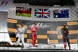 The podium (L to R): Race winner Lewis Hamilton (GBR) Mercedes AMG F1 celebrates with the champagne with Sebastian Vettel (GER) Ferrari and Daniel Ricciardo (AUS) Red Bull Racing. 27.08.2017. Formula 1 World Championship, Rd 12, Belgian Grand Prix, Spa Francorchamps, Belgium, Race Day.