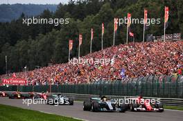 (L to R): Lewis Hamilton (GBR) Mercedes AMG F1 W08 and Sebastian Vettel (GER) Ferrari SF70H battle for the lead at the start of the race. 27.08.2017. Formula 1 World Championship, Rd 12, Belgian Grand Prix, Spa Francorchamps, Belgium, Race Day.