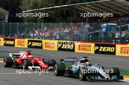 Lewis Hamilton (GBR) Mercedes AMG F1 W08 leads Sebastian Vettel (GER) Ferrari SF70H. 27.08.2017. Formula 1 World Championship, Rd 12, Belgian Grand Prix, Spa Francorchamps, Belgium, Race Day.