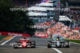 (L to R): Kimi Raikkonen (FIN) Ferrari SF70H and Lewis Hamilton (GBR) Mercedes AMG F1 W08 battle for position. 27.08.2017. Formula 1 World Championship, Rd 12, Belgian Grand Prix, Spa Francorchamps, Belgium, Race Day.