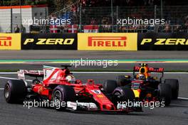 Sebastian Vettel (GER) Ferrari SF70H and Max Verstappen (NLD) Red Bull Racing RB13. 26.08.2017. Formula 1 World Championship, Rd 12, Belgian Grand Prix, Spa Francorchamps, Belgium, Qualifying Day.