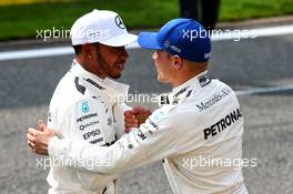(L to R): Lewis Hamilton (GBR) Mercedes AMG F1 (Right) celebrates his pole position in qualifying parc ferme with third placed team mate Valtteri Bottas (FIN) Mercedes AMG F1. 26.08.2017. Formula 1 World Championship, Rd 12, Belgian Grand Prix, Spa Francorchamps, Belgium, Qualifying Day.