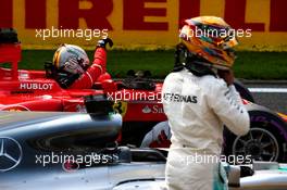 Sebastian Vettel (GER) Ferrari SF70H and Lewis Hamilton (GBR) Mercedes AMG F1 W08 in qualifying parc ferme. 26.08.2017. Formula 1 World Championship, Rd 12, Belgian Grand Prix, Spa Francorchamps, Belgium, Qualifying Day.